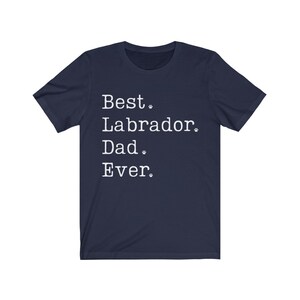 May include: Navy blue t-shirt with white text that reads "Best Labrador Dad Ever."