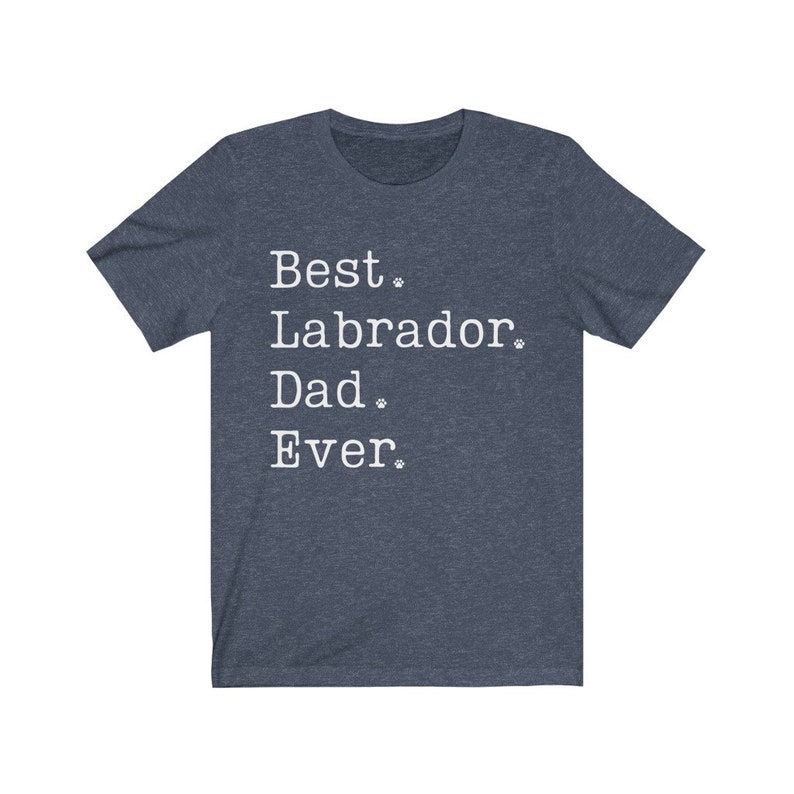May include: A dark blue t-shirt with white text that reads "Best Labrador Dad Ever."  The text is in a typewriter font and includes paw prints.