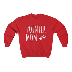 May include: Red sweatshirt with white text that says "POINTER MOM" with two white paw prints.