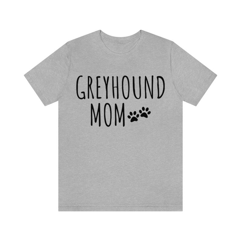 May include: Grey heather t-shirt with black text that reads "Greyhound Mom" with two paw prints.