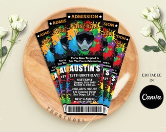 May include: A colorful ticket invitation for a 15th birthday paintball party. The ticket has a black background with colorful paint splatters and a black and white image of a person wearing a paintball mask. The text on the ticket reads "You're Been Tergeted to Join The Fun in Celebrating AU AUSTIN'S 15TH BIRTHDAY!" and includes the date, time, and location of the party. The ticket also includes a phone number for RSVP.