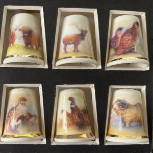 Highland Scenes. Boxed set of six bone china thimbles .Former Royal Worcester Artist