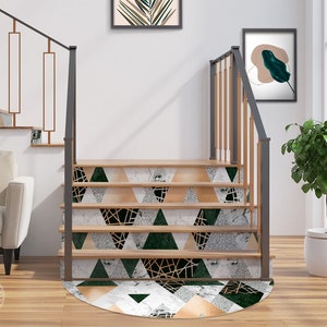 May include: A set of stair treads with a geometric pattern featuring green, white, and gold accents. The treads are made of a durable material and are easy to install.