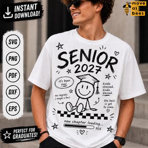 May include: White t-shirt with black graphics, including the word "SENIOR 2027" and a graduation cap. The shirt also features phrases like "it's been real" and "new chapter loading..." with a 75% progress bar. The design is perfect for graduates.