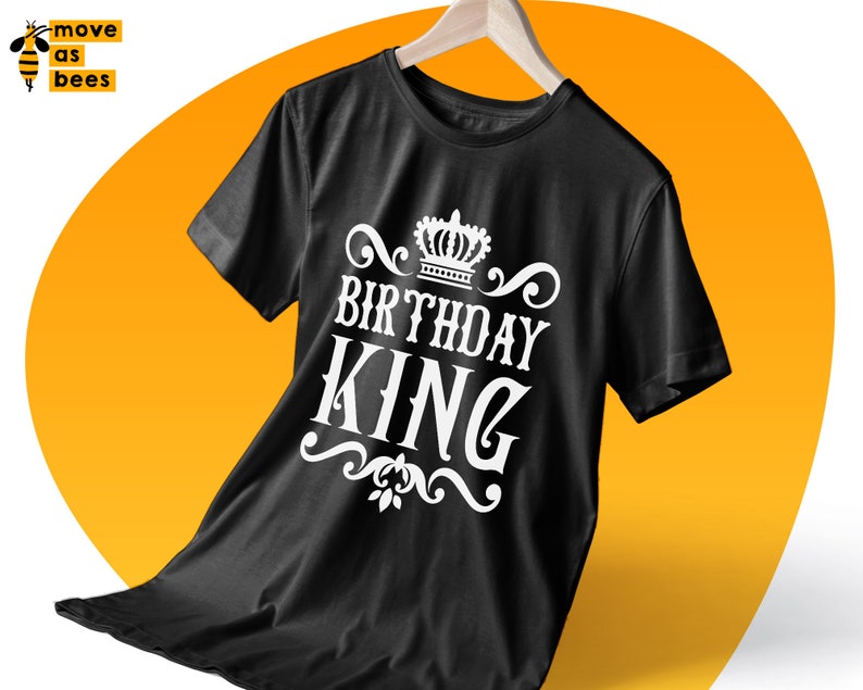 May include: Black t-shirt with a white crown and the text "Birthday King" printed on the front.