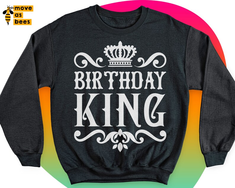 May include: Black sweatshirt with a white crown and the text "Birthday King" in a decorative font.