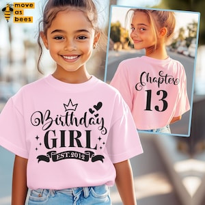 May include: Pink t-shirt with the text "Birthday Girl" and a crown above the text. The text "EST. 2012" is below the text "Birthday Girl". The back of the shirt has the text "Chapter 13".