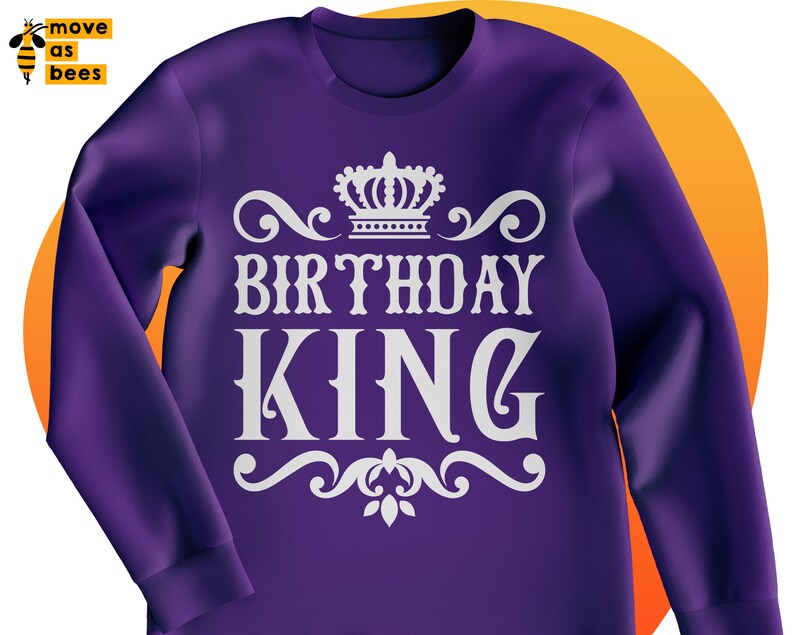May include: Purple sweatshirt with a white crown and the text "Birthday King" in a decorative font.