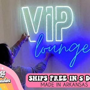 May include: A white neon sign with the word "VIP" in large letters and the word "lounge" in a smaller, cursive font. The sign is lit up in blue and white.
