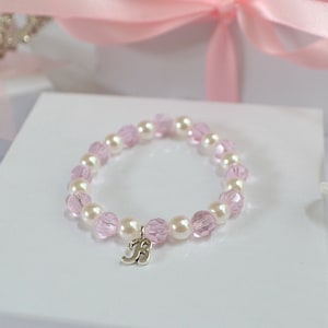 Pulseira infantil personalizada com cristais Swarovski rosa.