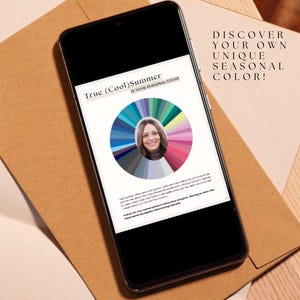 May include: A smartphone displaying a color wheel with a woman's face in the center. The text on the screen reads "True (Cool) Summer If Your Personal Color". The text above the phone reads "DISCOVER YOUR OWN UNIQUE SEASONAL COLOR!"