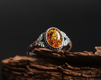 Beautiful amber sterling silver ring. Natural cognac Baltic amber with golden flakes. Unique and exceptional Anniversary gift. Adjustable
