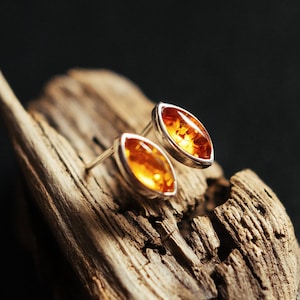 Elegant, minimalist, small earrings. Sterling silver 925, natural Baltic amber. Cognac ( orange ) color. Comfortable, stylish for everyday