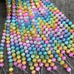 thumbnail image 2 of Natural Pink Cat's Eye Calcite Selenite Round Beads Loose 6/8/10/12/14mm 2 of 6