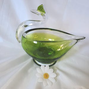 Characterful Swan figurine in a wonderful olive green hand blown glass.  Stunning item.