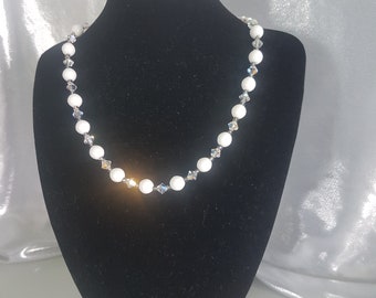 Beautiful Handmade White Necklace.  Bright White Ceramic beads combined with the Sparkle of Swarovski.  Perfect for your Wedding Day!