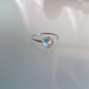 Absolutely delightful teeny tiny little 6mm Swarovski Crystal ring.  UK Size 5.  Stunning