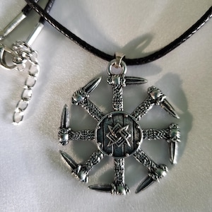 The Dharma Wheel pendant necklace, also known as the Dharmachakra, is a powerful Buddhist symbol.