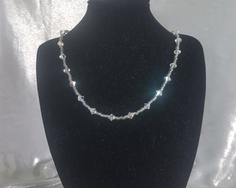 Unique Handmade necklace which will compliment any Bridal outfit.  Using Swarovski crystal.  Simply stunning!