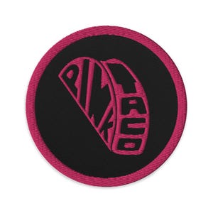 Broderad rosa taco-lapp | En lesbisk ikon
