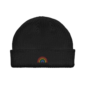May include: Black knitted beanie with a rainbow embroidered on the front.
