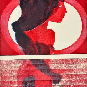May include: An abstract print in red and white featuring a silhouette of a person's head and shoulders. The print is in a modern style with bold colours and geometric shapes.
