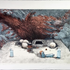 May include: An abstract print with a muted colour palette. The artwork features a central, textured, reddish-brown form against a backdrop of grey and blue tones. Several white, spherical objects and small brown bowls are arranged on a light-coloured surface.
