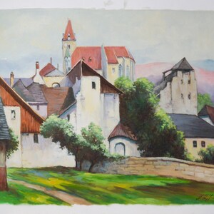 May include: A painting depicting a small village with white buildings, a red-roofed church, and green trees. The buildings are clustered together and there is a stone wall in the foreground.