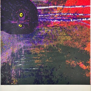 May include: An abstract print in black, purple, red and yellow. The print features a black cat with yellow eyes looking down at the viewer.