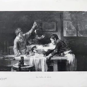 May include: A black and white photograph of two people in a kitchen setting. One person is holding a bowl and the other is stirring a pot. The text "Les halles de Rouen" is printed below the image.