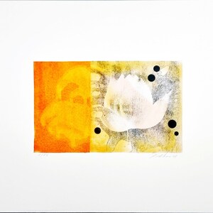 May include: A print of a stylised flower with a yellow and orange background. The flower is white with a pink centre and is surrounded by black dots.