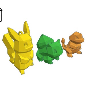 Może przedstawiać: Trzy postaci Pokemon&oacute;w wydrukowane w 3D: Pikachu, Bulbasaur i Charmander. Pikachu jest ż&oacute;łty, Bulbasaur jest zielony, a Charmander jest pomarańczowy.