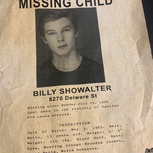 May include: A missing child poster with a photo of a young boy with brown hair and blue eyes. The poster includes the boy's name, Billy Showalter, his address, 8270 Delware St, and a description of his appearance. The poster also includes a phone number to call with any information: (303) 164-4200.