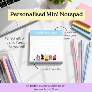 May include: A square notepad with a light blue header featuring the text a note from mum and five illustrated cats at the bottom. The notepad has 54 pages of 120gsm paper and measures approximately 9cm by 9cm, accompanied by three gel pens.