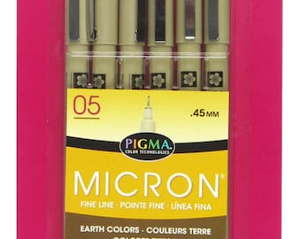 May include: A package of six Pigma Micron fine-line pens in earth tones. The pens are 0.45 mm and have archival ink. The package is pink and yellow with the brand name Pigma and Sakura of America.