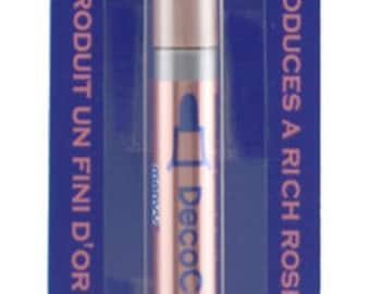 May include: A rose gold DecoColor Premium-Prime marker pen with a blue cap. The packaging features the text "DecoColor. PREMIUM-PRIME" and "PRODUCES A RICH ROSE-GOLD FINISH".