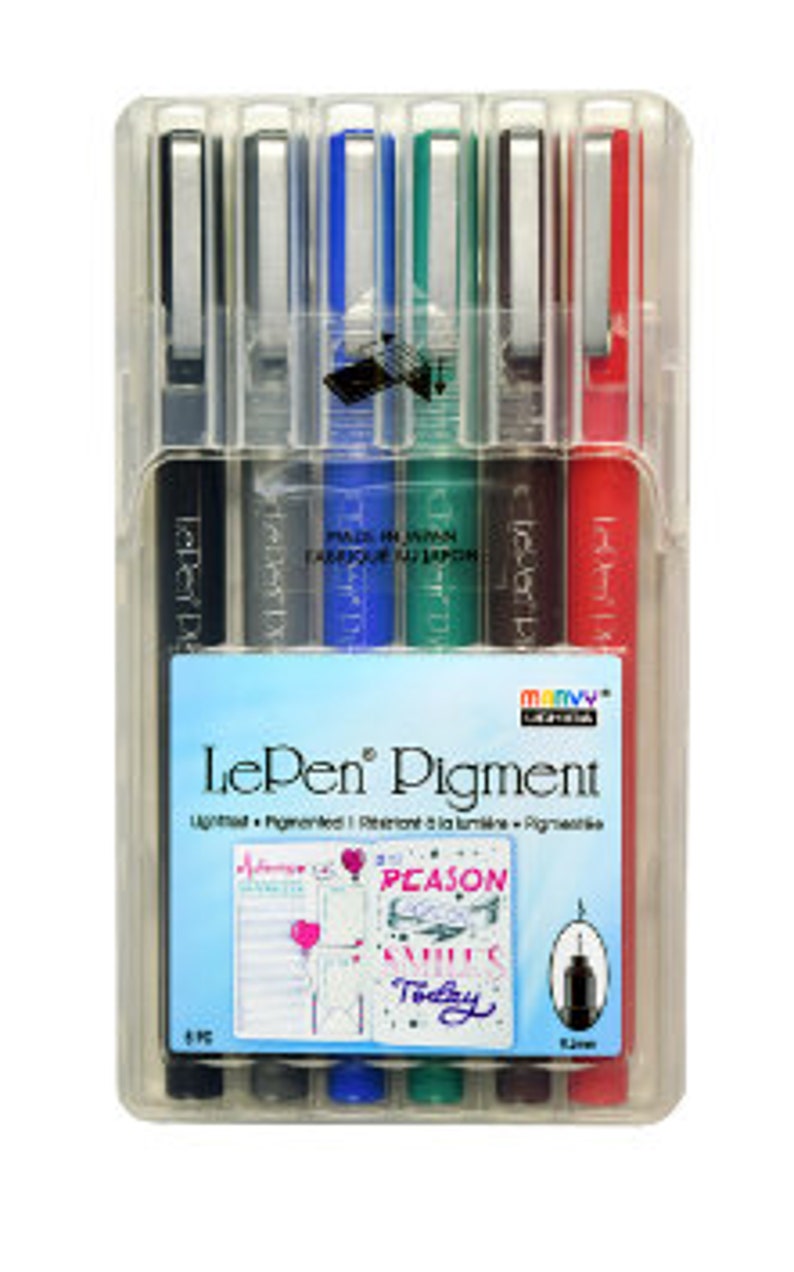 May include: A set of six Le Pen Pigment fineliner pens in a clear plastic case. The pens are black, blue, green, red, brown, and turquoise. The case has a label that says "Le Pen Pigment" and "Lightfast - Pigmented - Resistant to Smudging - Archival - Non-toxic".