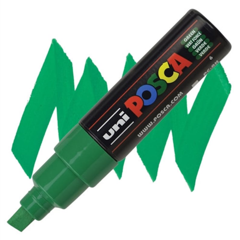 May include: A green Uni Posca paint marker with the text "Uni Posca" and "www.posca.com" on the side. The marker has a black cap and a green barrel. The text "Green, Vert fonc&eacute;, Gr&uuml;n, Verde, Verde" is printed on the cap.