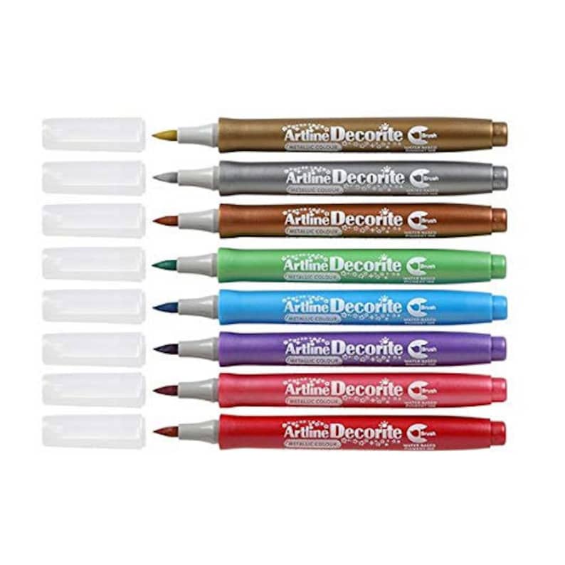 May include: Set of ten water-based metallic markers with brush tips. The markers are labeled "Artline Decorite Metallic Colour". The colors are gold, silver, copper, green, blue, purple, red, pink, and two shades of brown.