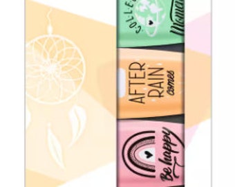 May include: A set of four pastel-colored highlighters with inspirational quotes. The highlighters are in a clear plastic package with a white background. The quotes are "Collect Moments", "After Rain Comes", "Be Happy", and "Dream On".
