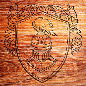 May include: A black and white line drawing of a knight's helmet with a plume, inside a shield with a decorative border. The image is carved into a wooden surface.