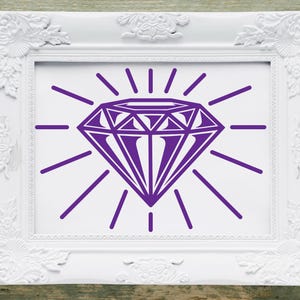 May include: A white picture frame with a purple diamond graphic inside. The diamond has a sunburst design behind it.