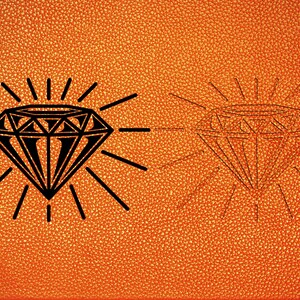 May include: A black diamond shape with radiating lines on an orange textured background. The diamond is outlined in black and has a white interior.