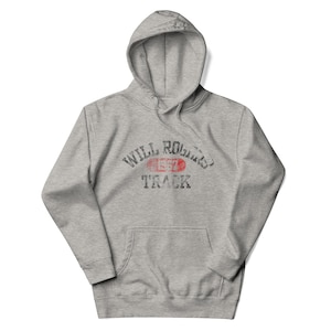 May include: A gray hooded sweatshirt with a vintage-style graphic print that reads "Will Rogers Track 1957".