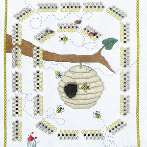 May include: A cross-stitch pattern of a beehive with bees flying around it. The beehive is brown and white with a black entrance. The bees are yellow and black. The pattern is surrounded by a yellow border.