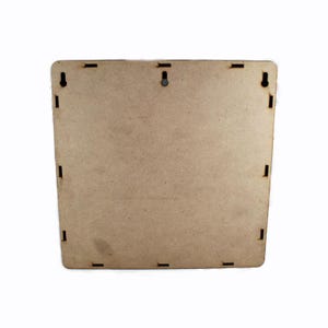 May include: A square, unfinished wooden panel with a light brown color. The panel has several small rectangular slots cut into the sides and two circular holes near the top for hanging. The edges are slightly rounded.