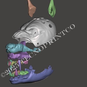May include: A 3D digital model of a creature head assembly featuring a grey skull with circular holes, a light blue snout, a purple jaw structure, green teeth, and a dark blue lower jaw. Two detached ear-like pieces in tan and green are above.