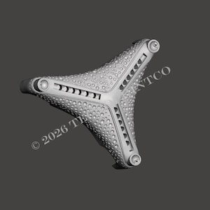 May include: A gray, three-pronged object with a textured surface and small, rounded protrusions. Each prong has a series of rectangular cutouts and rounded ends. The text "© 2026 TINTCO" is visible.