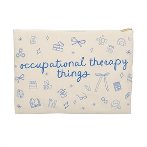 May include: A beige canvas zippered pouch with a blue outline of various occupational therapy tools and the text "occupational therapy things".