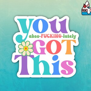 May include: A colorful sticker with the text "you abs-o-fucking-lutely got this" in a retro font. The sticker features a daisy flower with a yellow center and white petals.